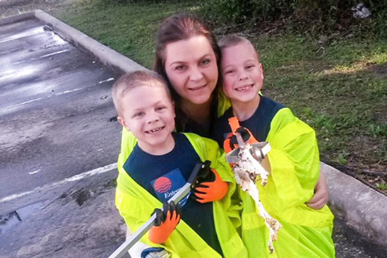 Jennifer with her twins (left to right), James and Brett, volunteering at the 2017 Earth Day Green Up event in The Woodlands, Texas.